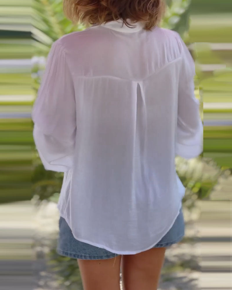 Enfärgad blus med långa ärmar