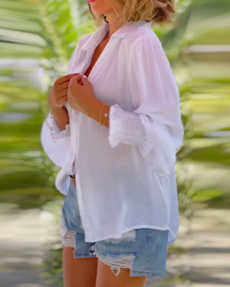 Enfärgad blus med långa ärmar