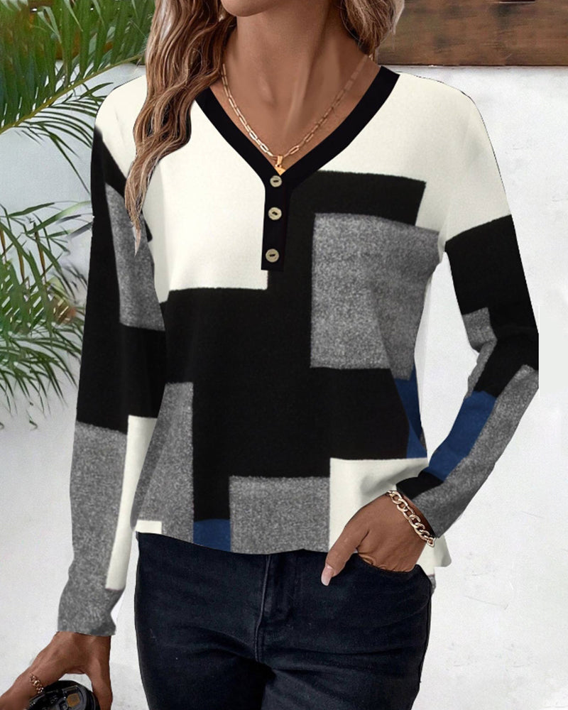 Topp med blockmönster och färgblockering