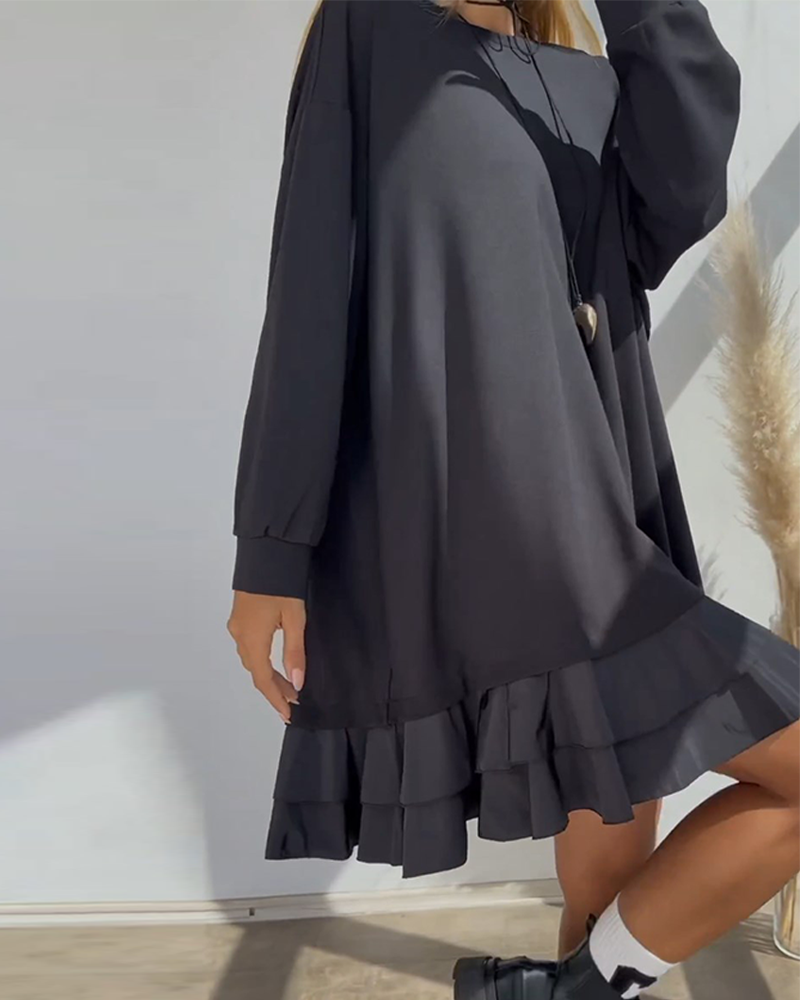 Löst enfärgad klänning med patchwork