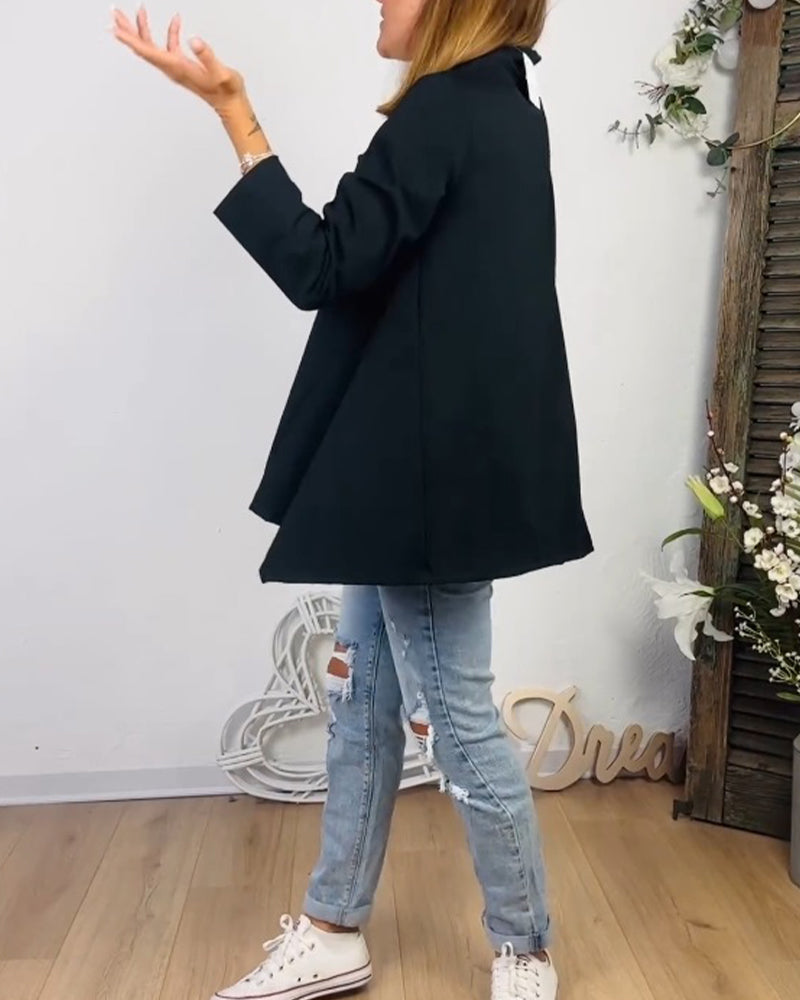 Avslappnad topp med rund hals och långa ärmar