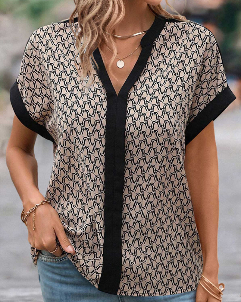 V-ringad blus med modetryck