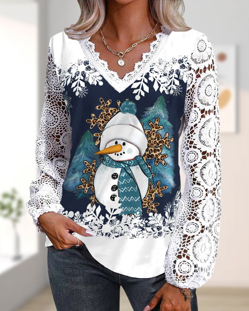 Blus med spets- och snögubbemönster