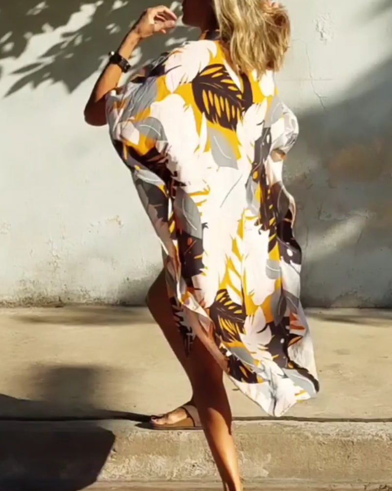 Klänning med fickor och lönnlövstryck