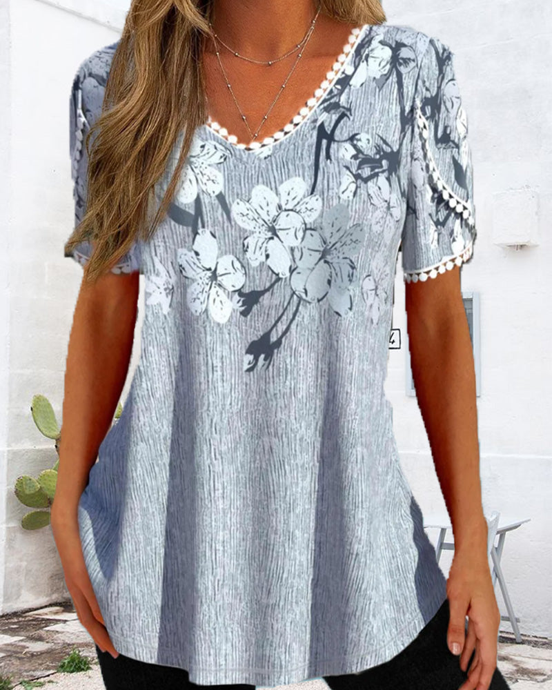 Elegant kort ärmad blus i blommigt tryck