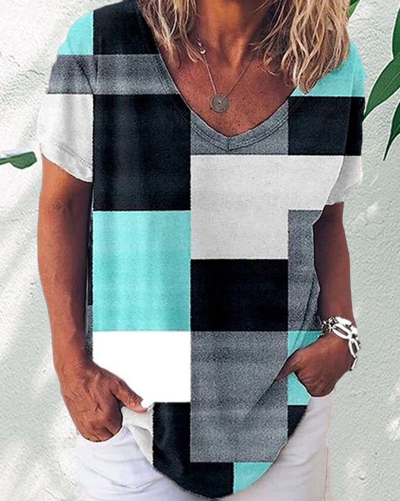 Blommig och plädtryckt T-shirt med korta ärmar