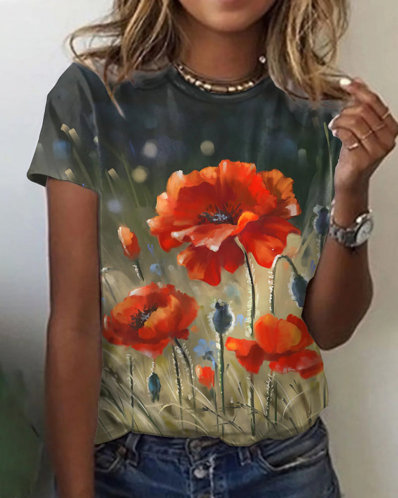 T-shirt i blommönster med rund hals och kort ärm