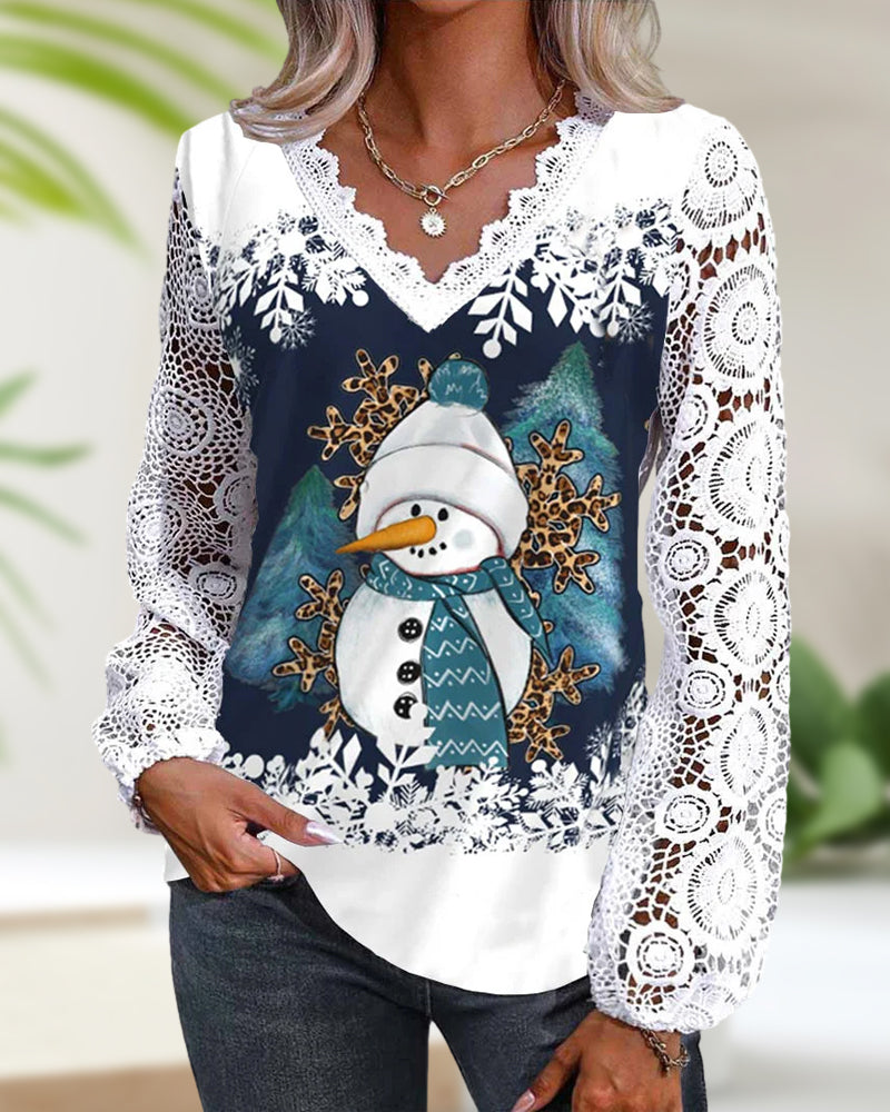 Blus med spets- och snögubbemönster