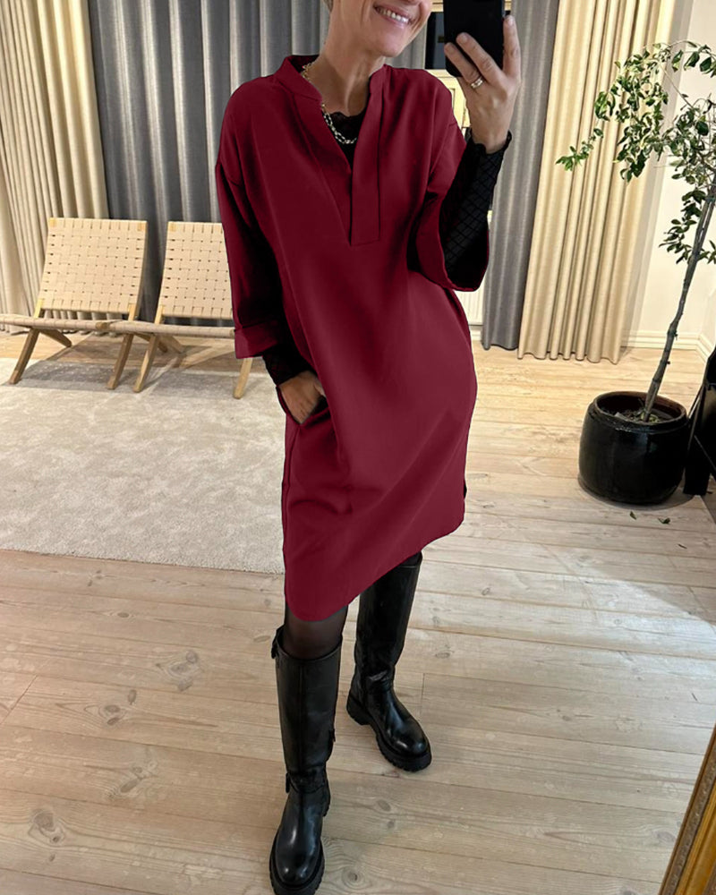 Skiftklänning med fickor och V-ringning