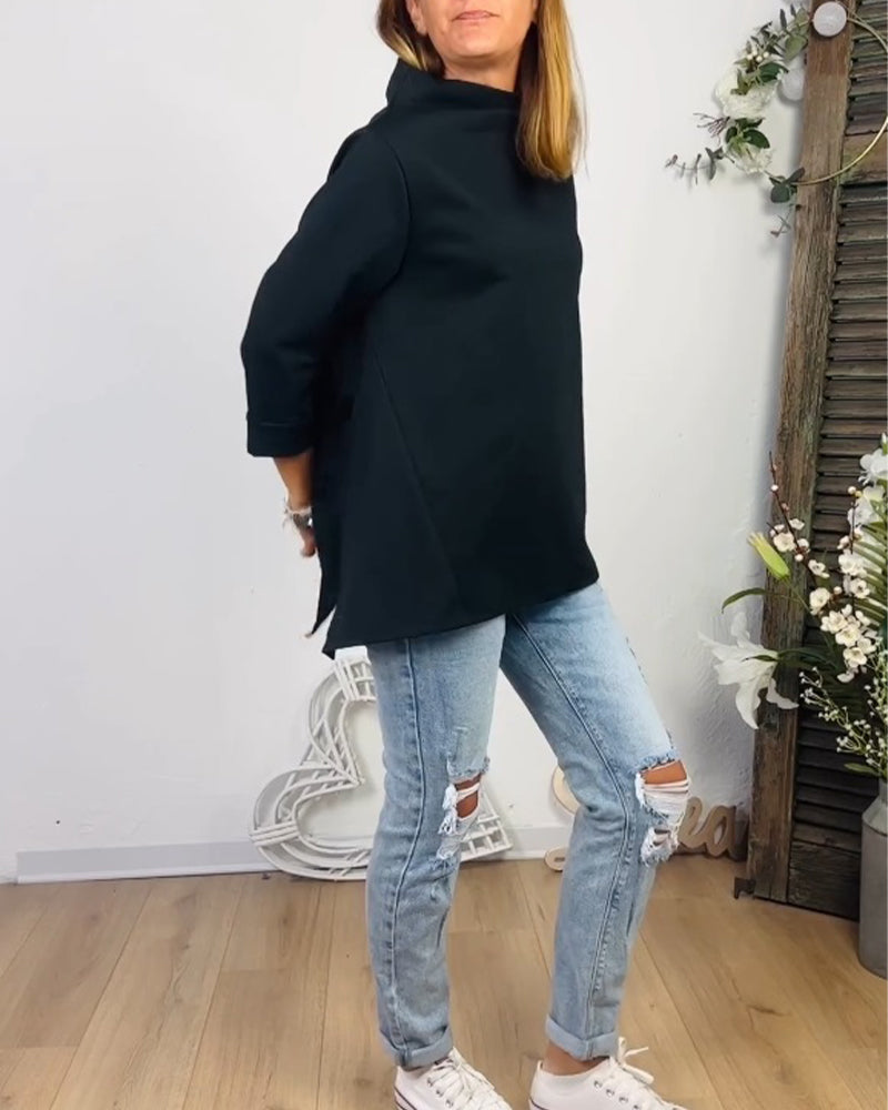 Avslappnad topp med rund hals och långa ärmar