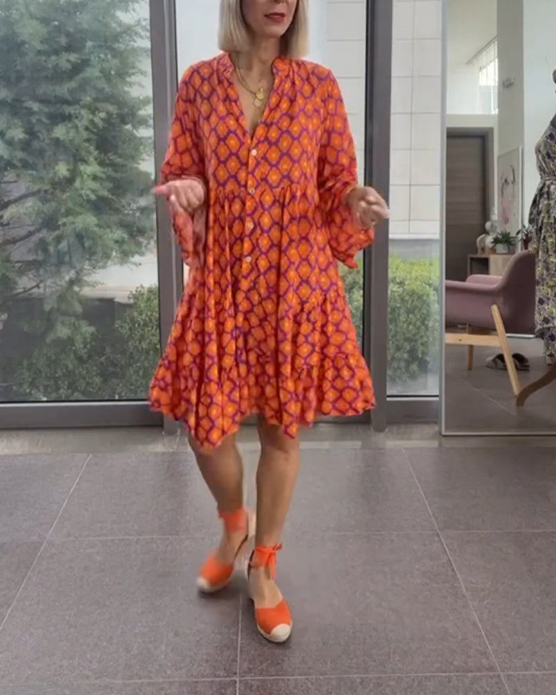 Klänning med V-ringning och elegant stil och tryck