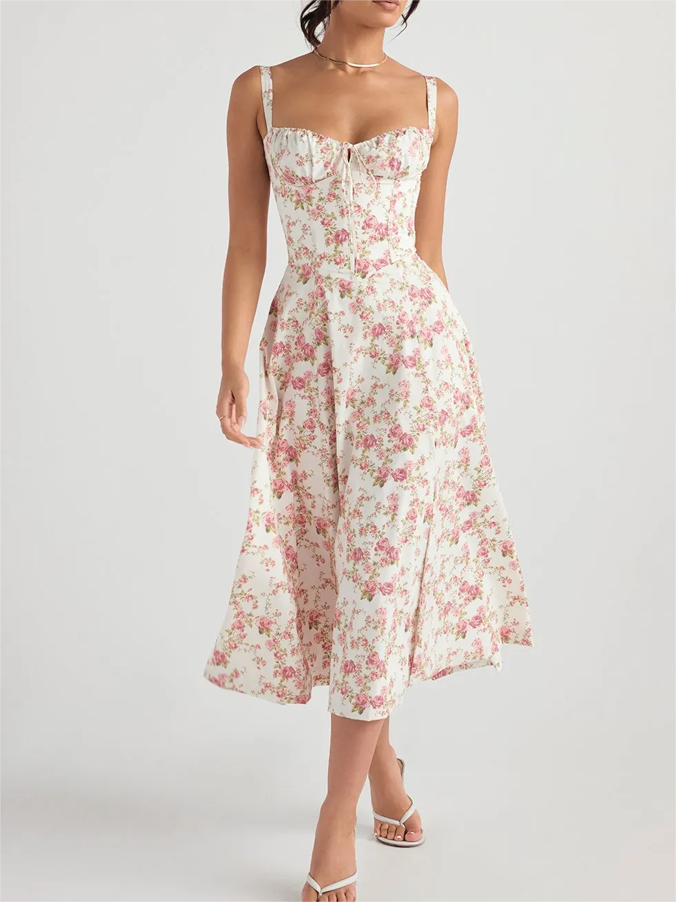 Blommig klänning med bustier som formar midjan