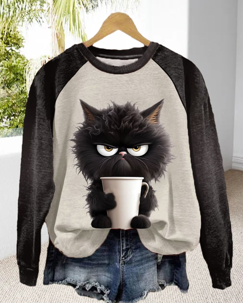 Lös sweatshirt med kattmotiv och färgblock