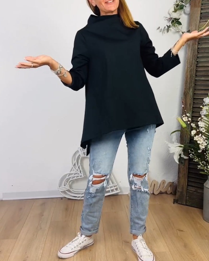 Avslappnad topp med rund hals och långa ärmar