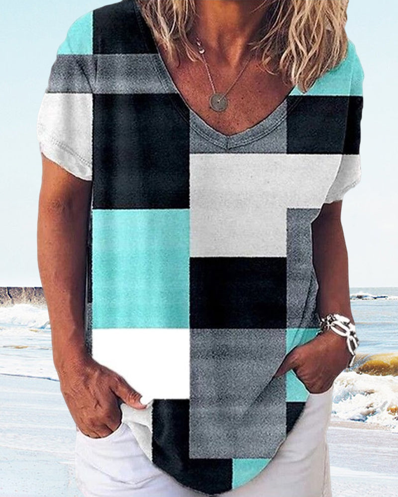 Blommig och plädtryckt T-shirt med korta ärmar