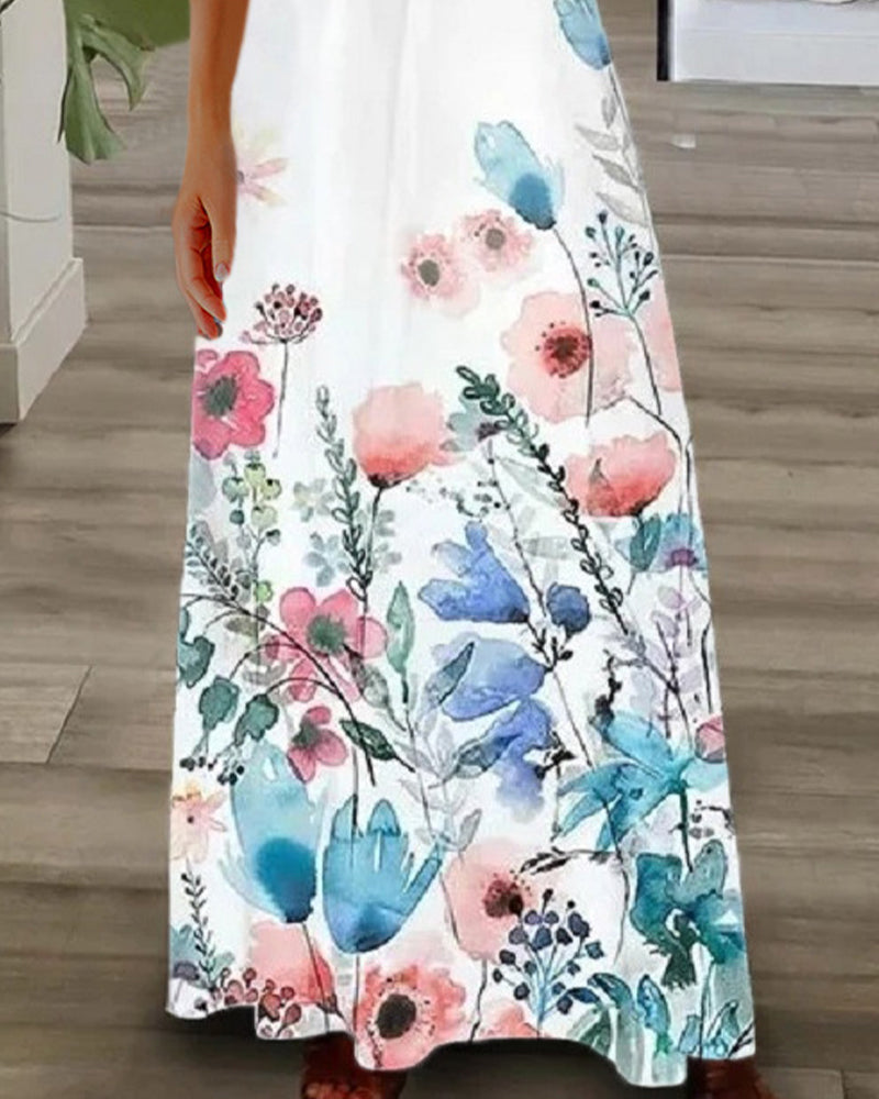 Blommig maxiklänning med spetsärmar