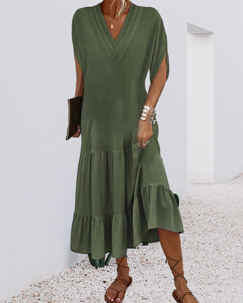 Enfärgad klänning med slitsärm och patchwork