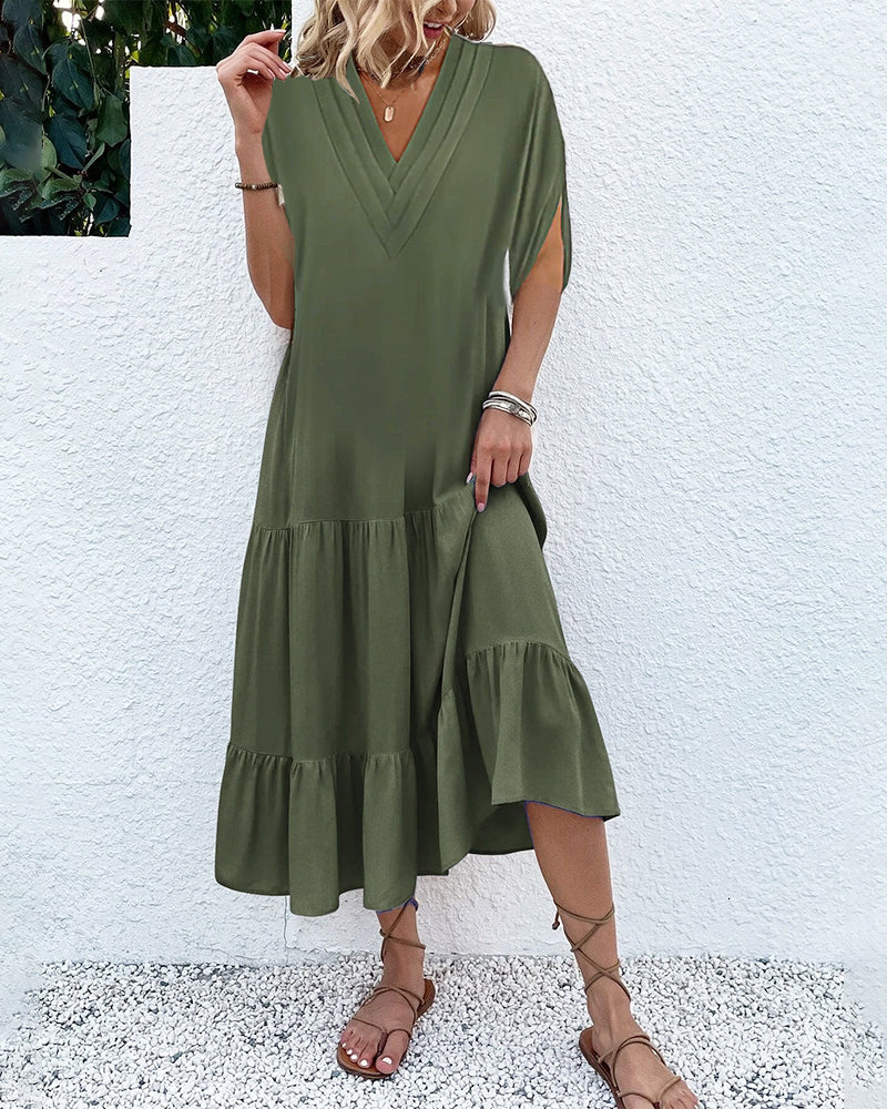 Enfärgad klänning med slitsärm och patchwork