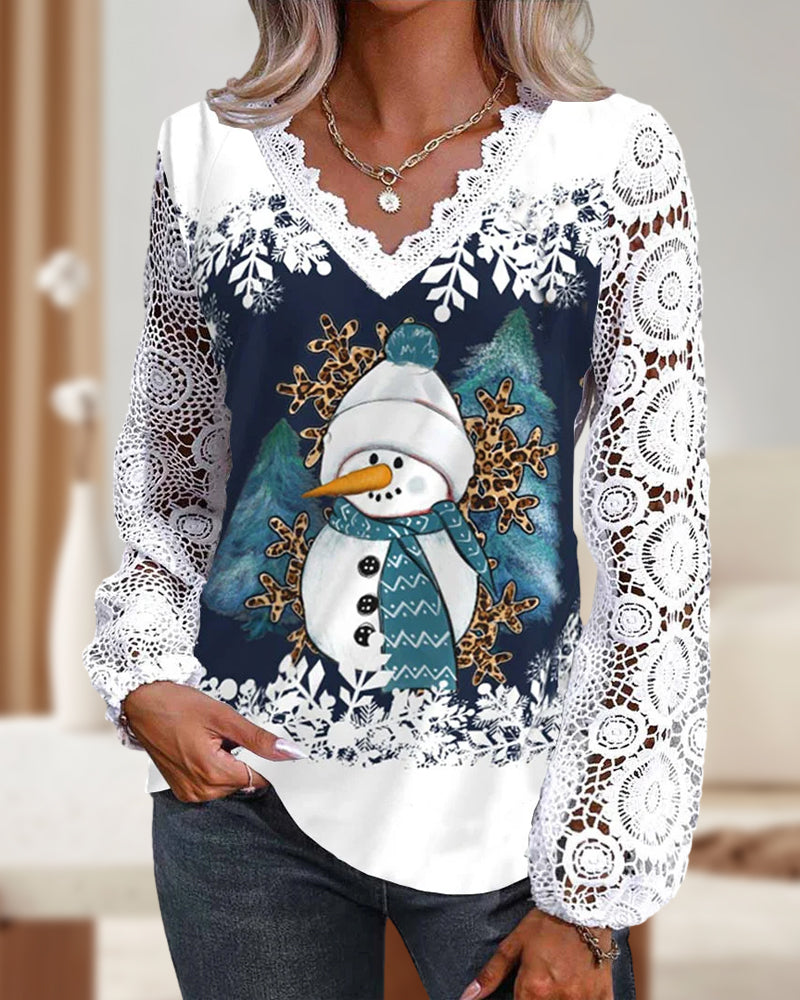 Blus med spets- och snögubbemönster
