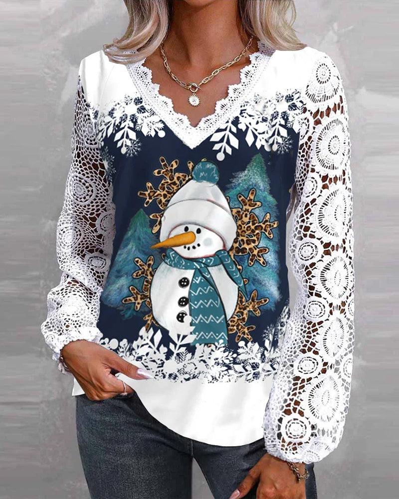 Blus med spets- och snögubbemönster