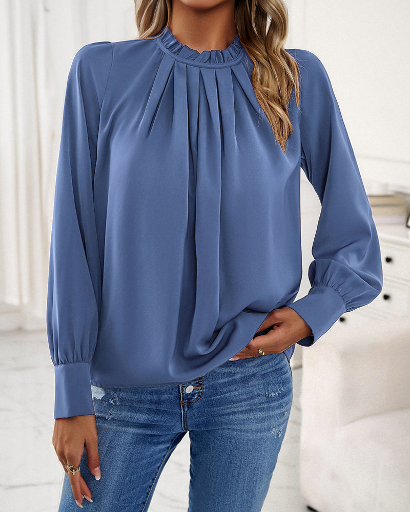 Elegant blus med volanger