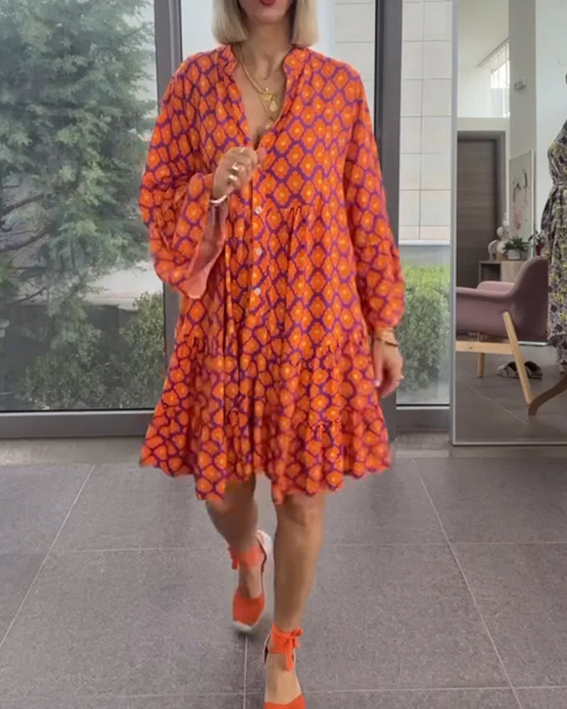 Klänning med V-ringning och elegant stil och tryck