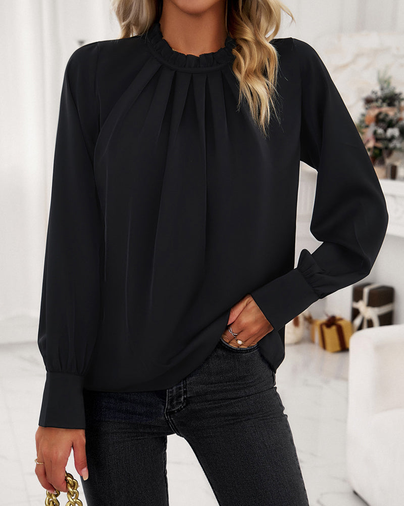 Elegant blus med volanger