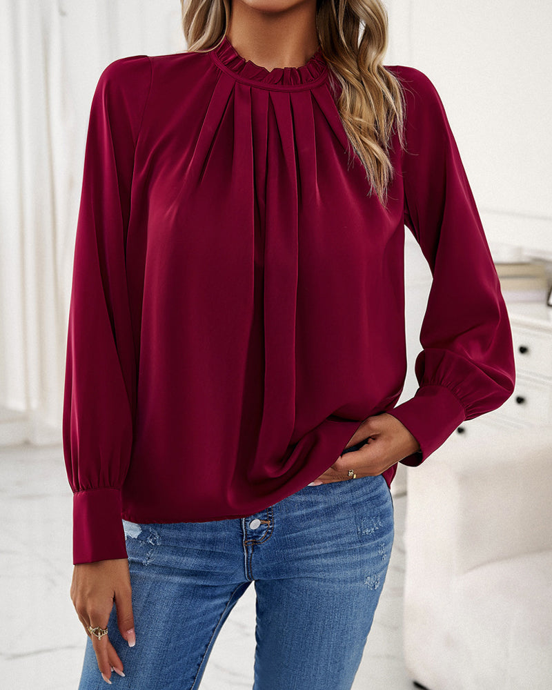 Elegant blus med volanger