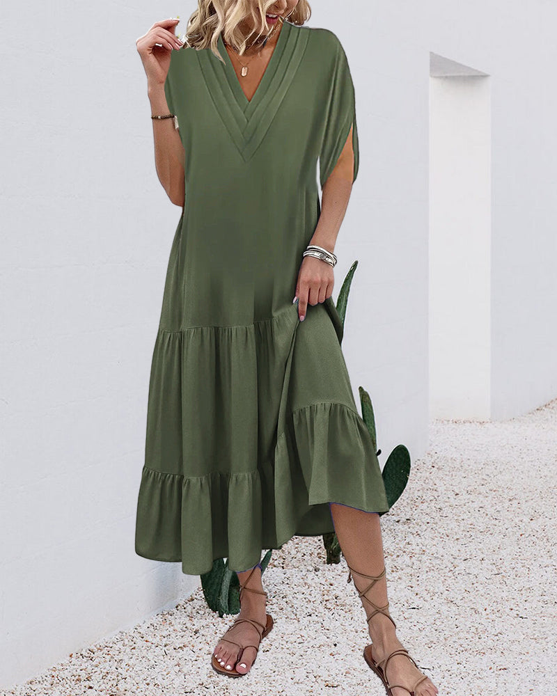 Enfärgad klänning med slitsärm och patchwork