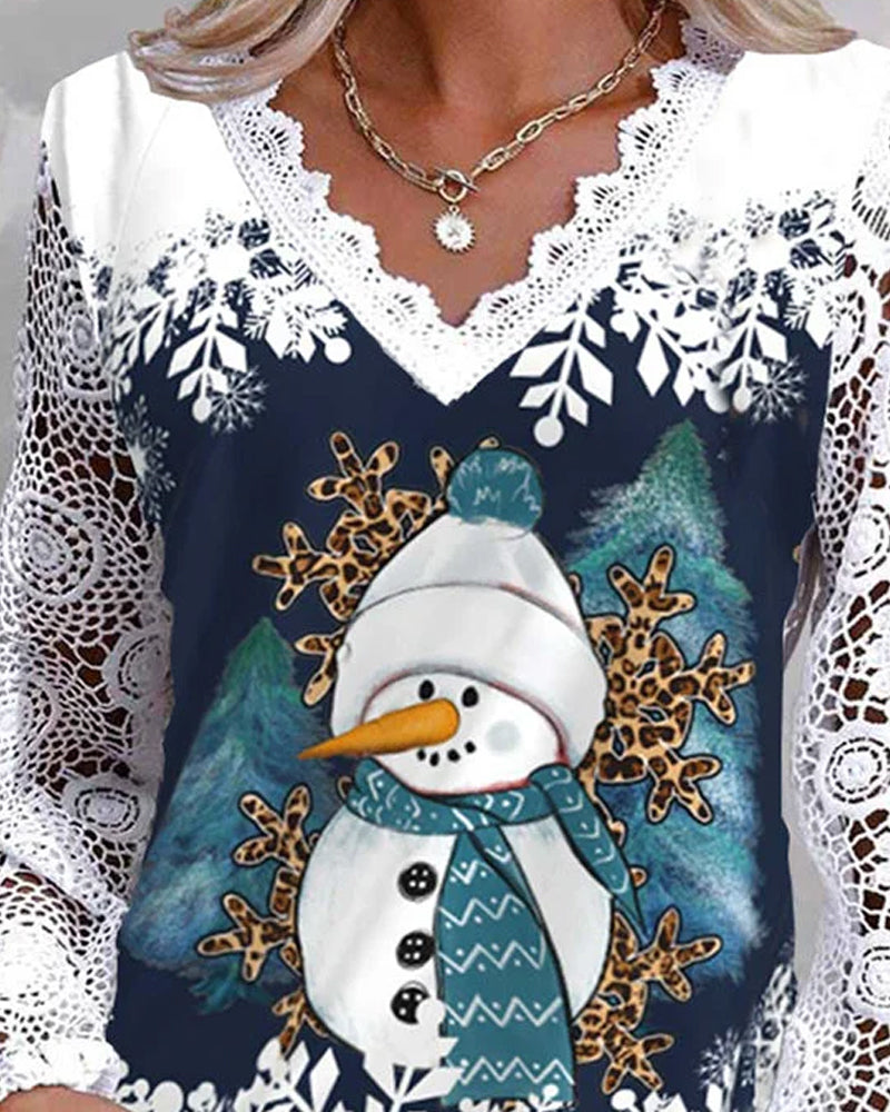 Blus med spets- och snögubbemönster