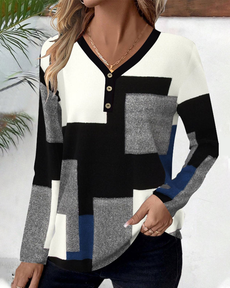 Topp med blockmönster och färgblockering