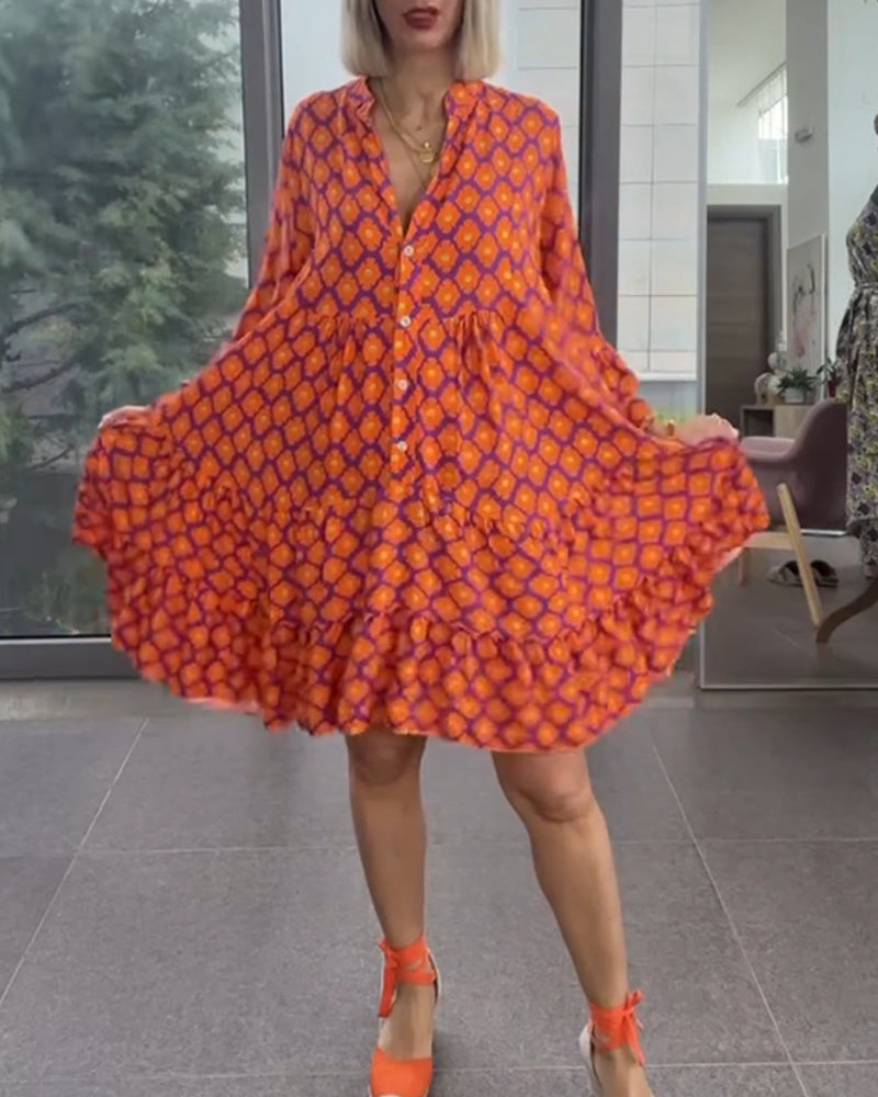 Klänning med V-ringning och elegant stil och tryck