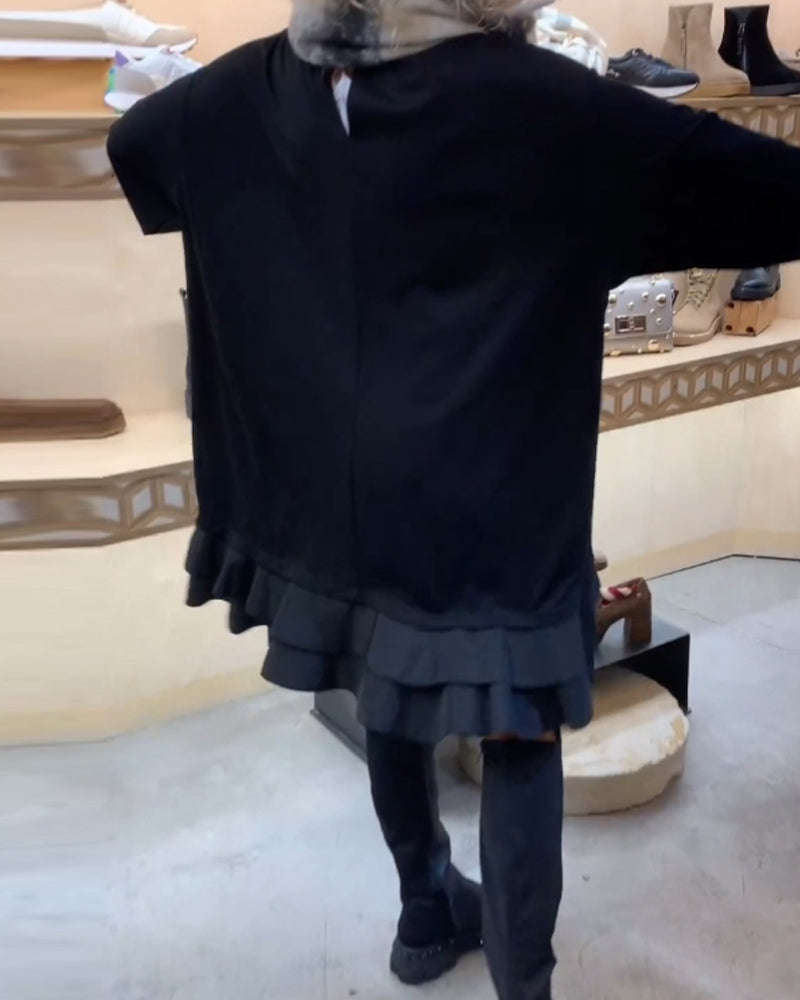 Klänning med elegant siluett och långa ärmar