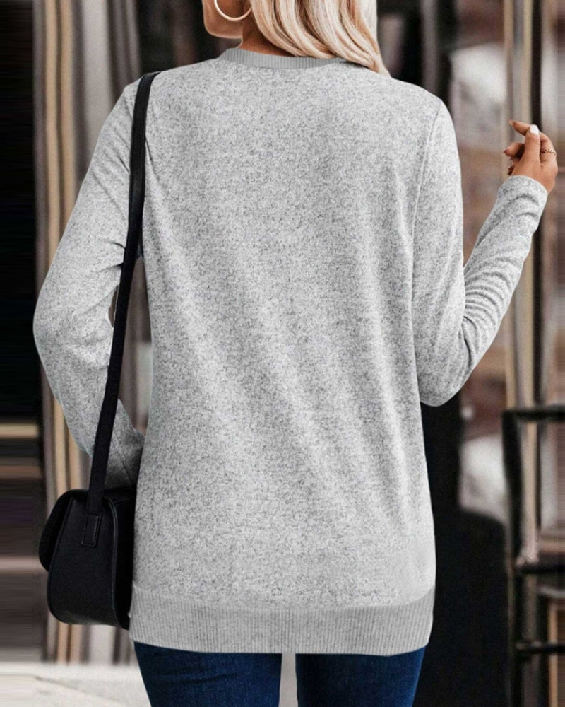 Avslappnad sweatshirt med korsfåll