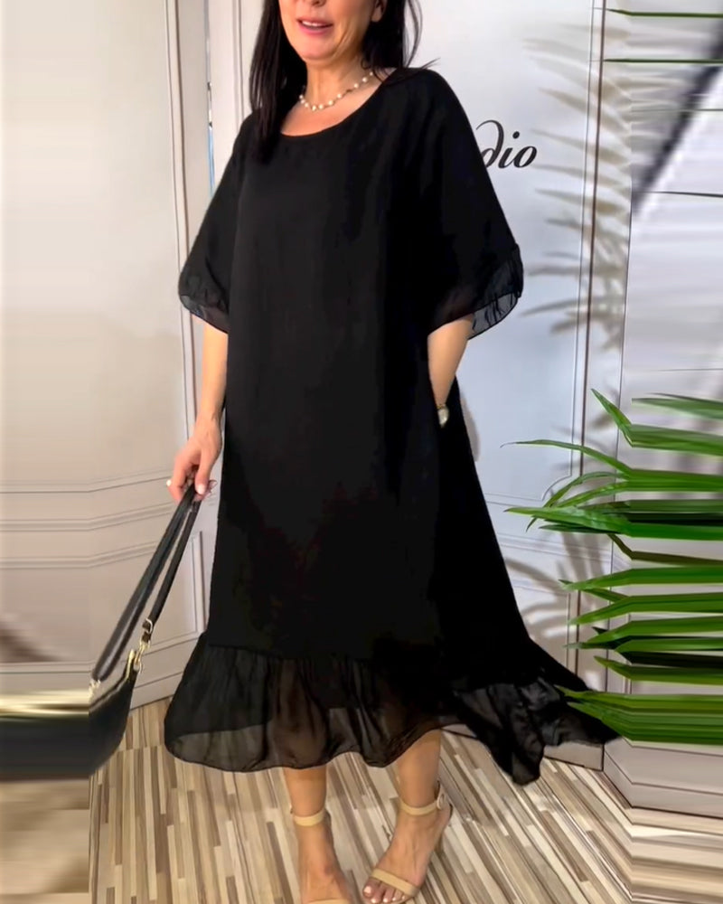 Kortärmad flödande klänning i panel