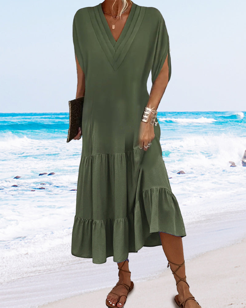 Enfärgad klänning med slitsärm och patchwork