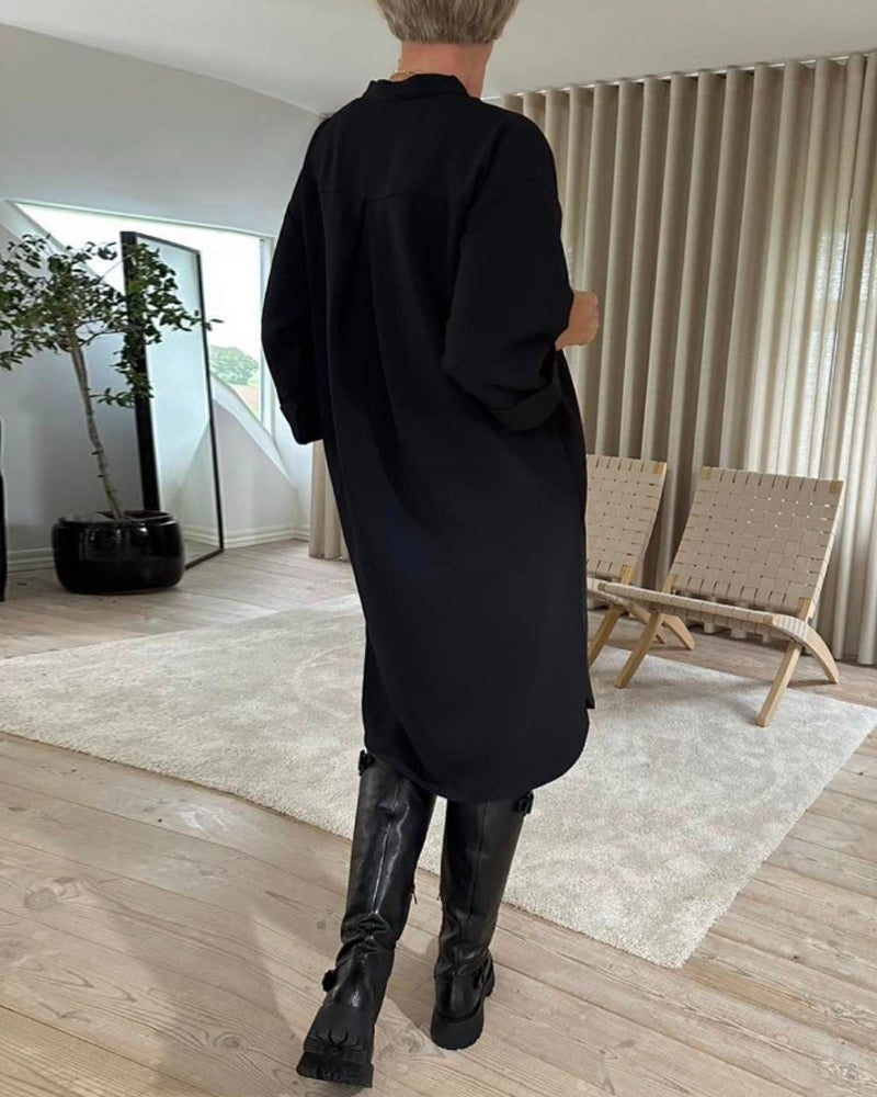 Skiftklänning med fickor och V-ringning