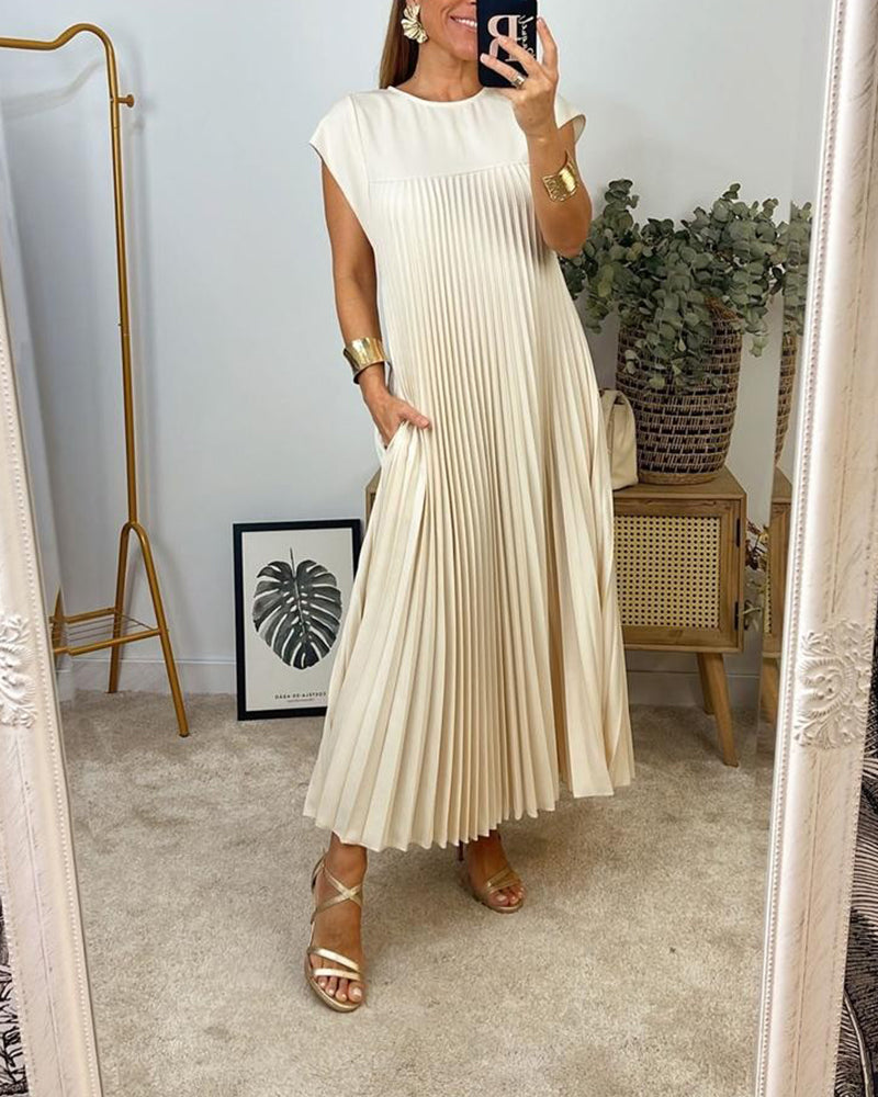Ärmlös plisserad chic till perfektion
