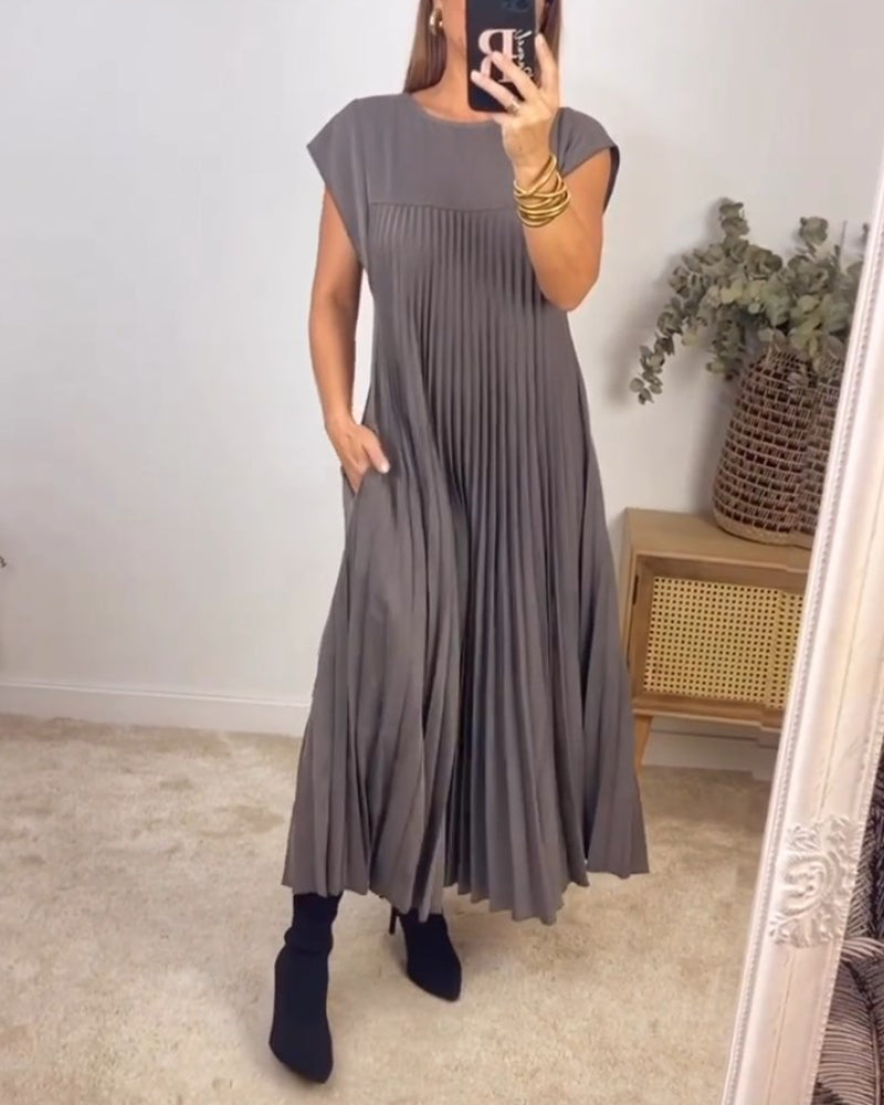 Ärmlös plisserad chic till perfektion