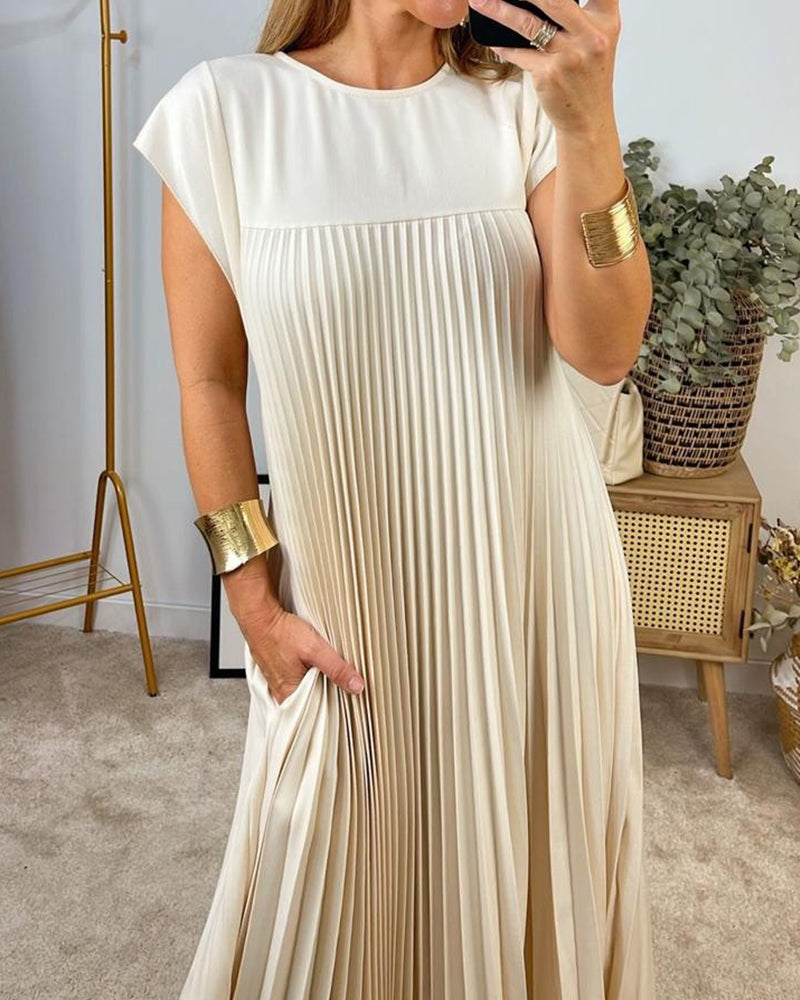 Ärmlös plisserad chic till perfektion