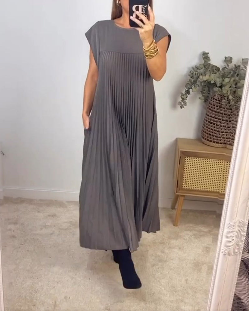 Ärmlös plisserad chic till perfektion
