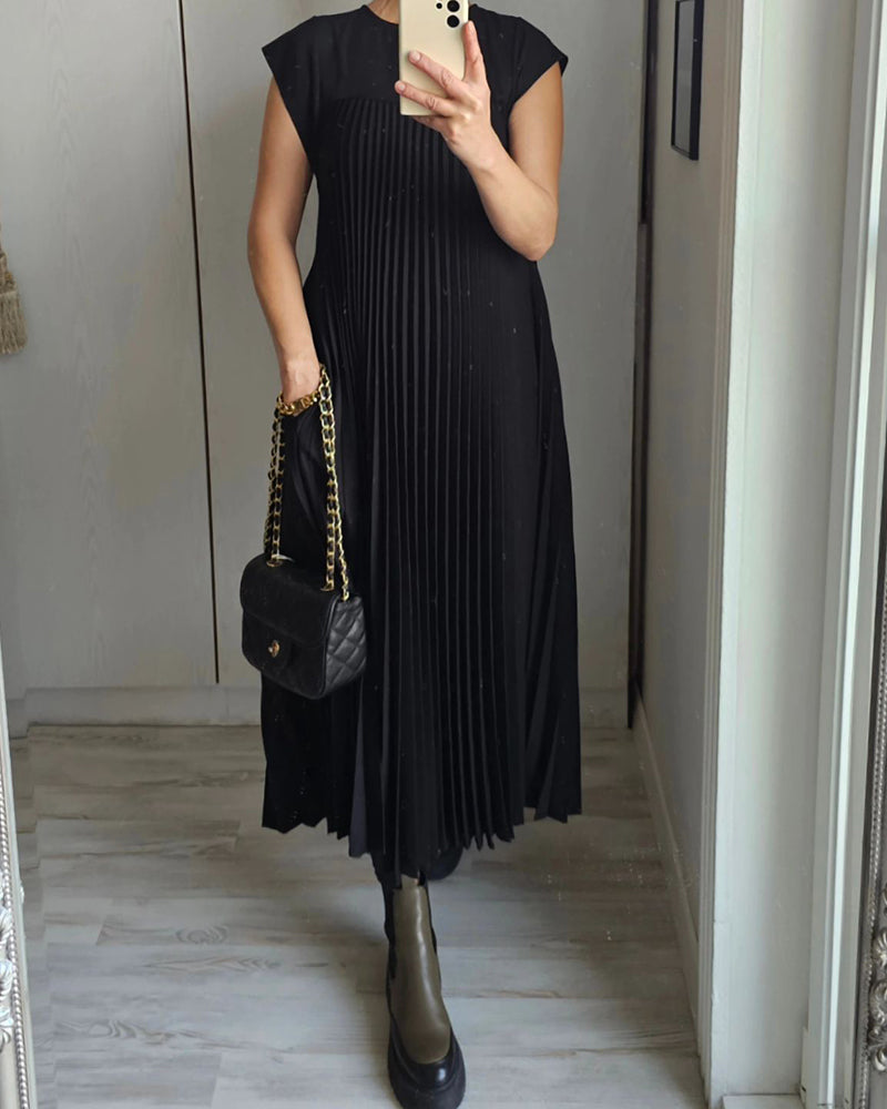 Ärmlös plisserad chic till perfektion