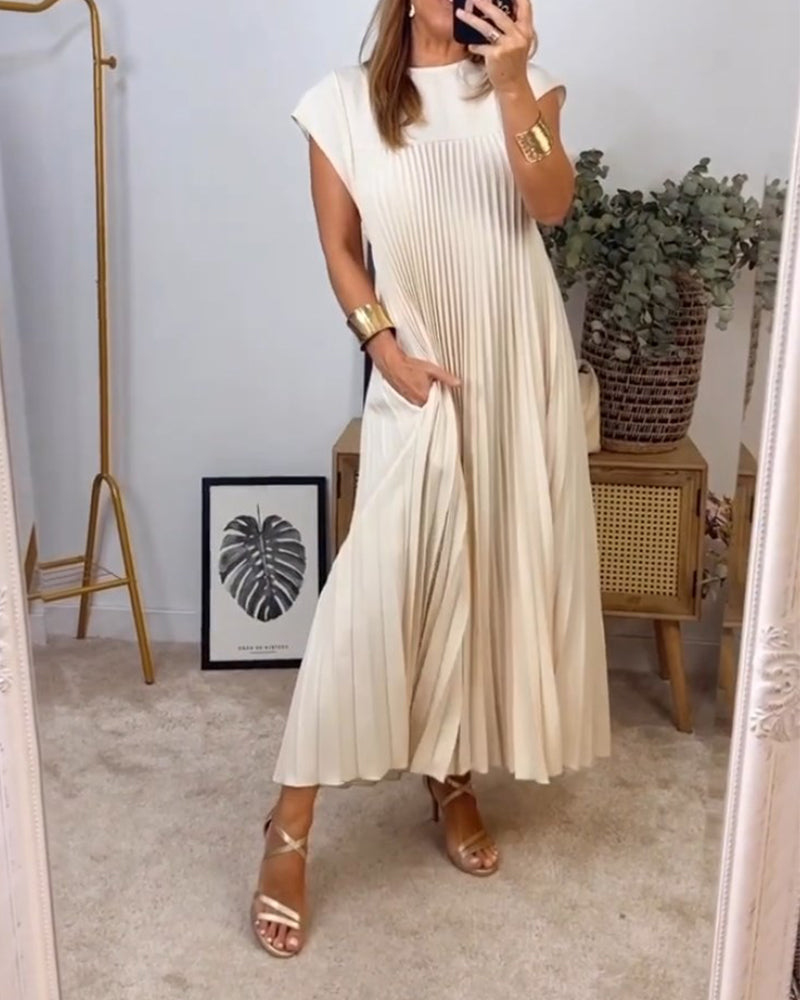 Ärmlös plisserad chic till perfektion