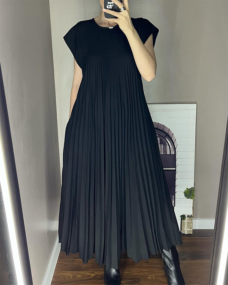 Ärmlös plisserad chic till perfektion